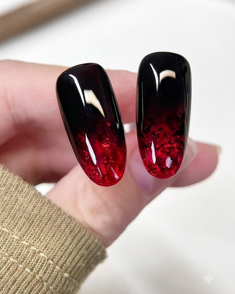 A brush applying a clear leveling gel coat over the red glitter design on the nail.