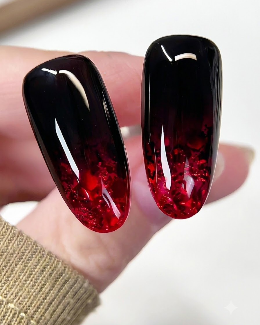 A brush gliding a glossy top coat across the entire surface of the finished ruby nail.