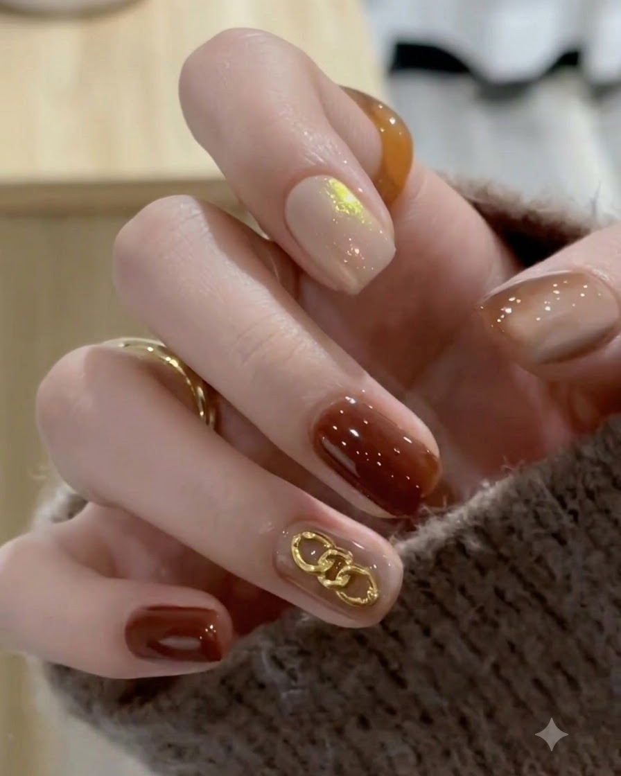 A close-up view of completed caramel amber gradient nails showing a high-gloss finish after final curing and wiping.