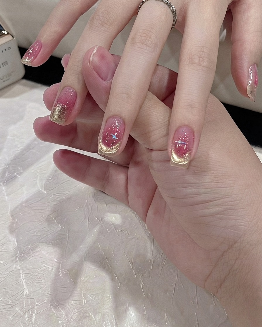 A fine cleaning brush perfecting the shape of a gold cat-eye French tip.