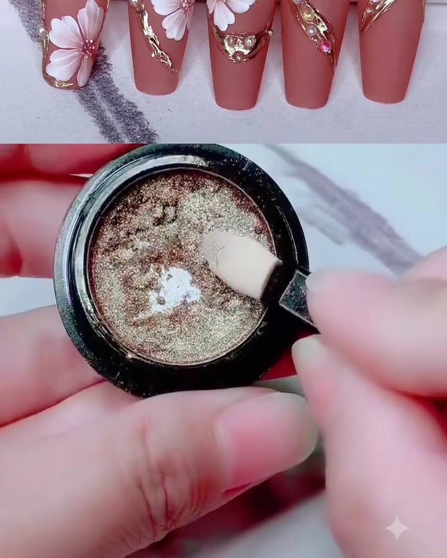 A sponge applicator dipping into a pot of metallic gold chrome pigment powder.