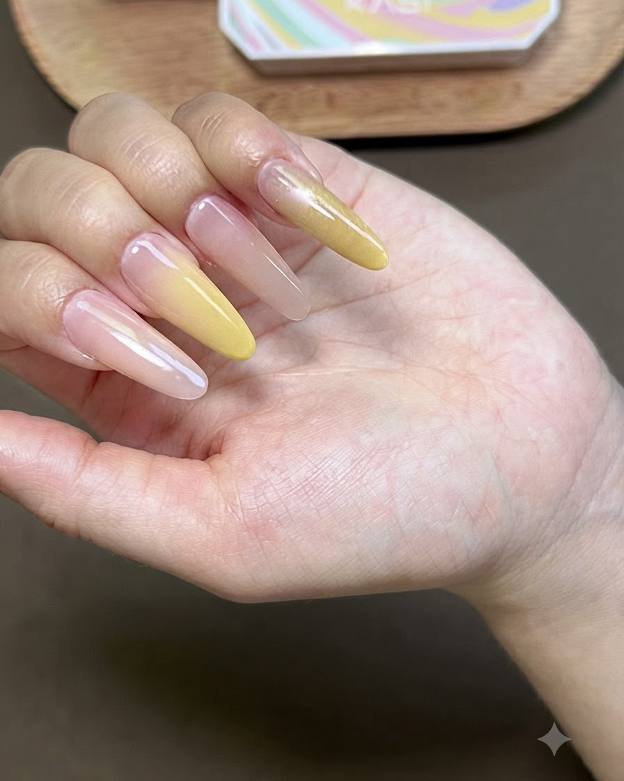 A hand with cat-eye gel polish curing under a UV nail lamp.