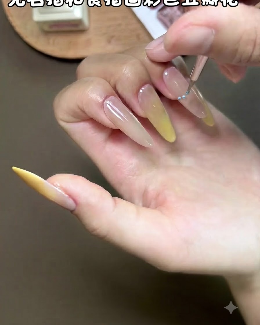 A fine liner brush carefully detailing a small flower petal design on a polished fingernail.