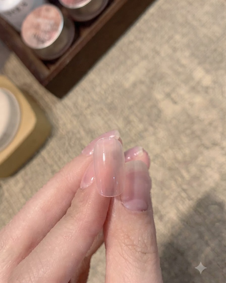 A clean, smooth gradient nail showing a soft pink base blending into a translucent tip.