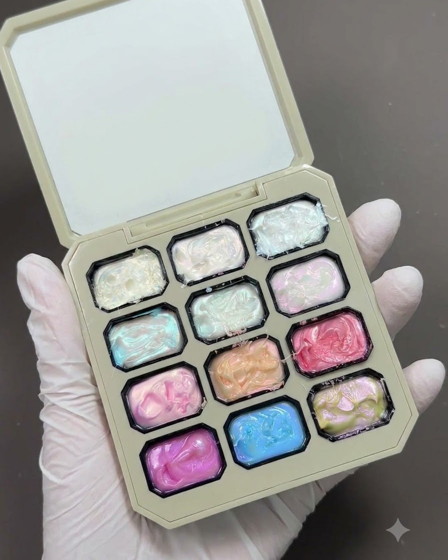 A nail art palette showing various colored high-gloss texture gel pots.