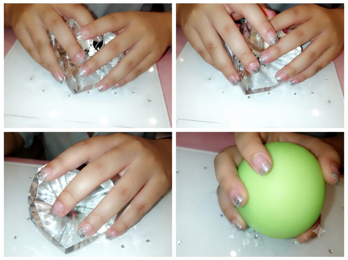A close-up shot showing a brush blending silver glitter particles upward on a nail.