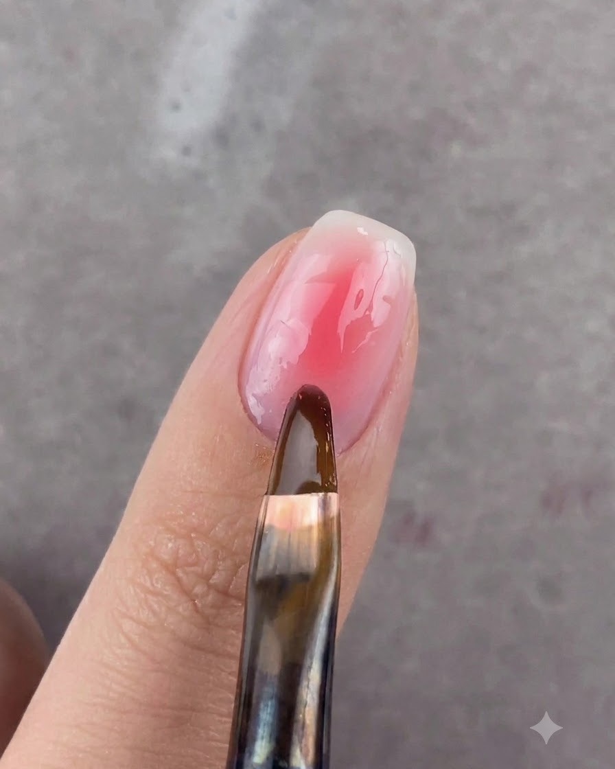 A finger placed inside a blue UV or LED nail curing lamp.