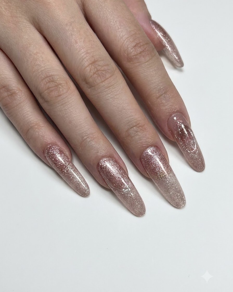 A hand positioned under a nail curing lamp with the ring finger illuminated.