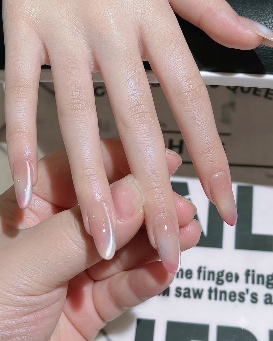 A brush smoothing and sealing top coat over the entire nail plate.