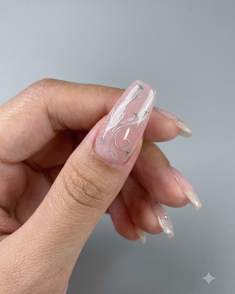 A completed cat eye gel nail showing a bright, concentrated central glass bead effect with star nail art accents.