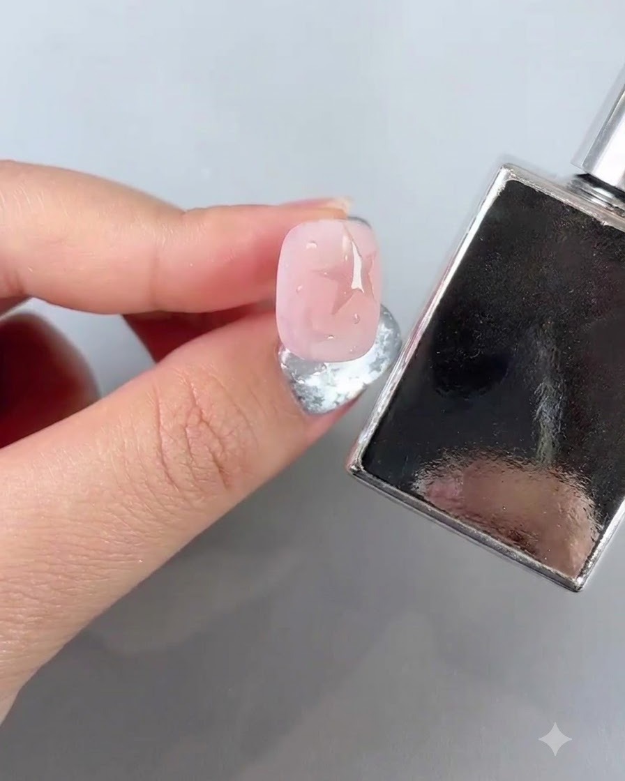 A manicured nail positioned near a curing lamp for 45 seconds.