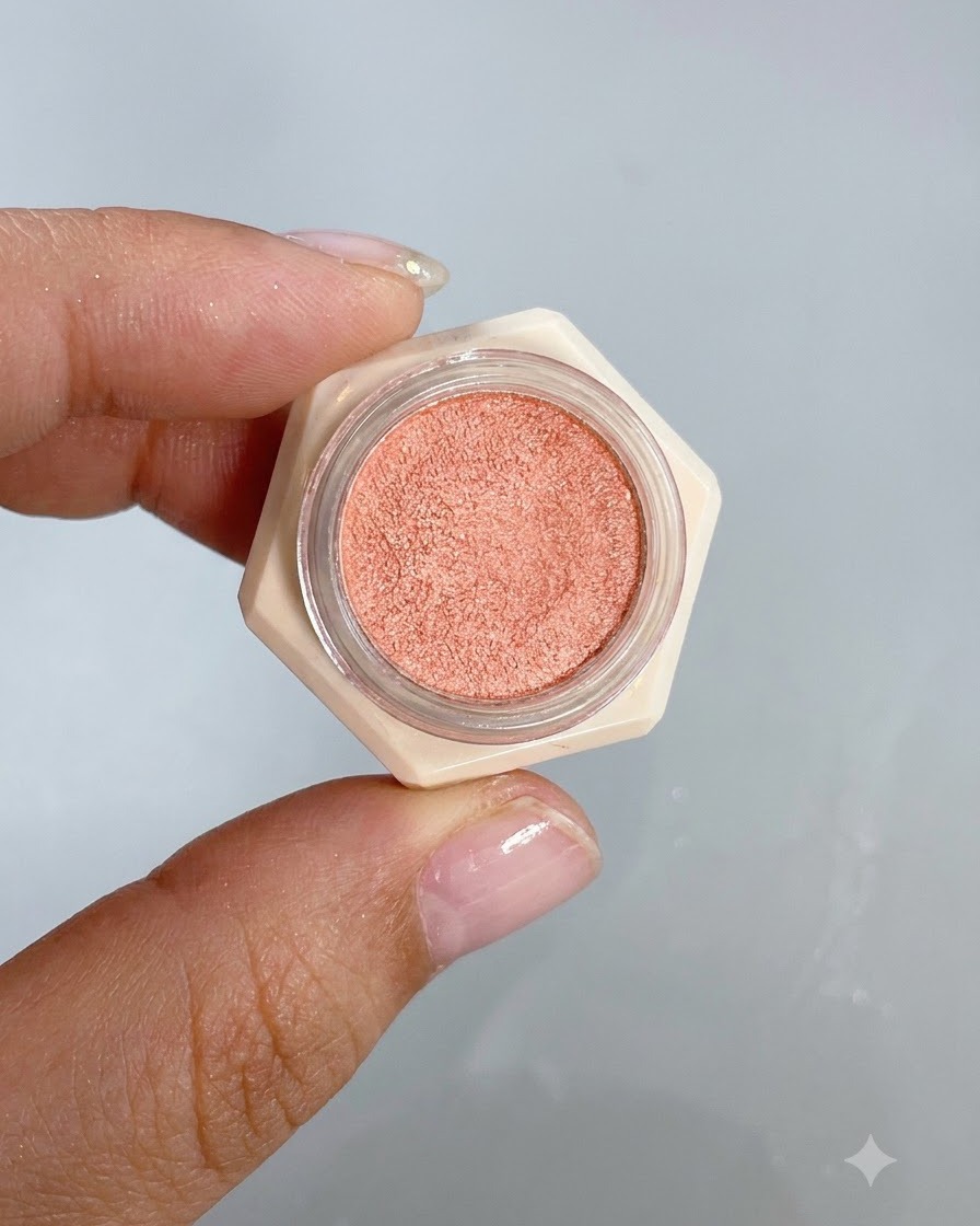 A small application brush dabbing colored gel onto the center of a nail to form a blush gradient.