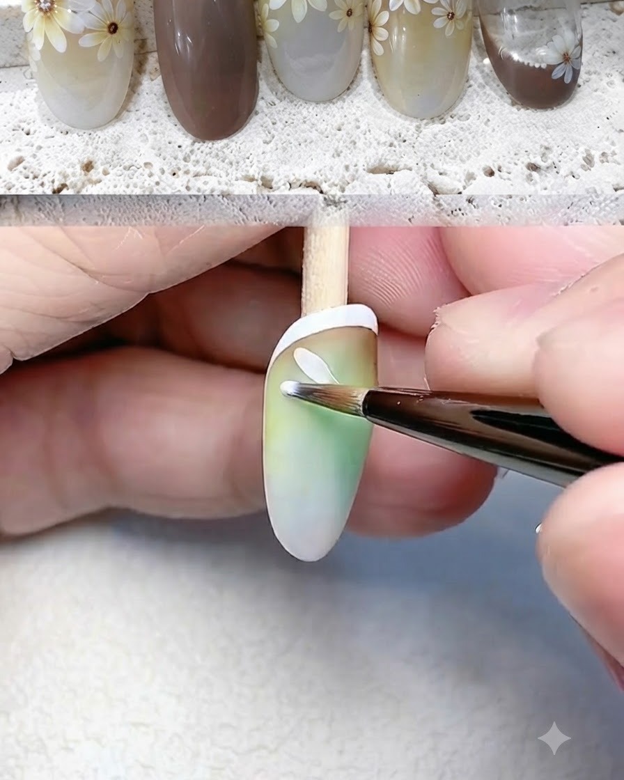 A fine liner brush painting individual white petals for a daisy flower on the nail.