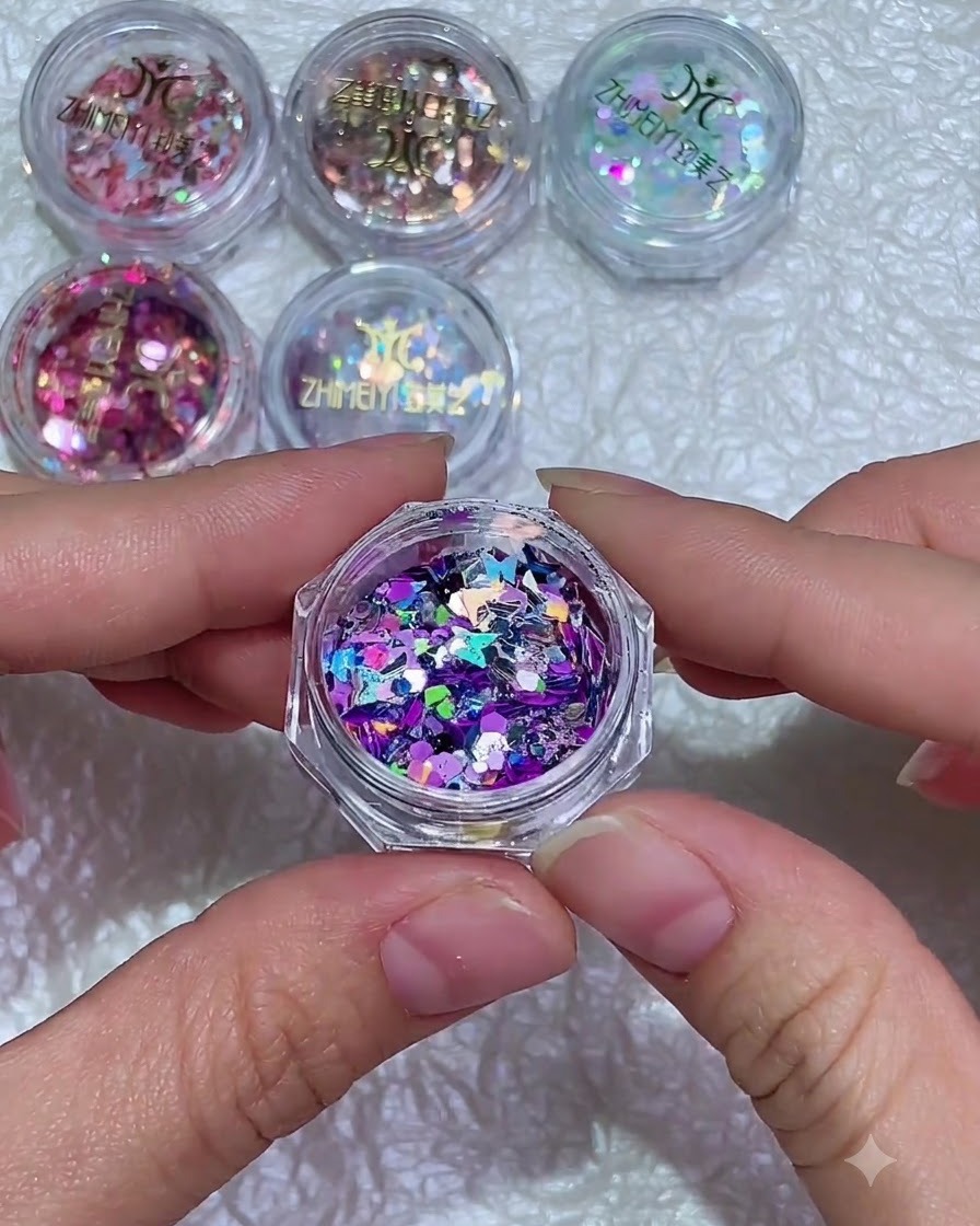 A close-up of a nail brush applying a clear layer of strengthening gel onto a natural fingernail.