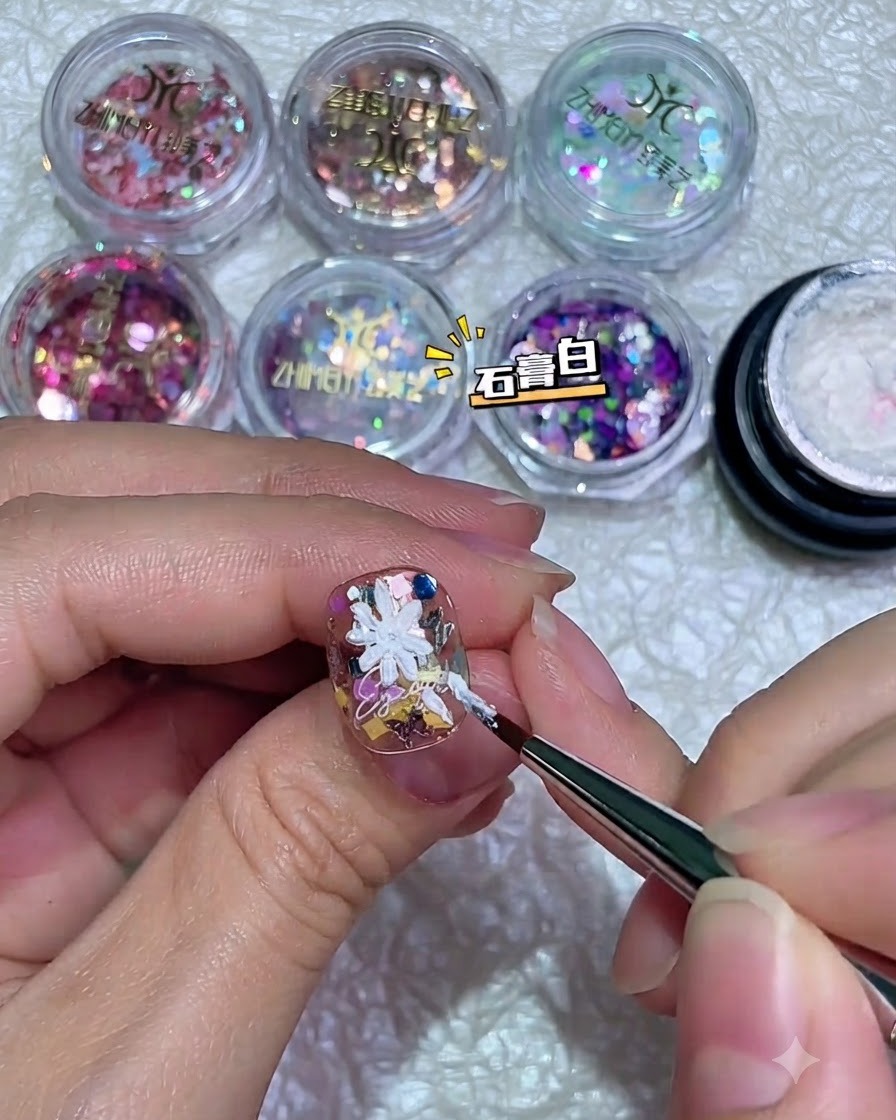 A fully formed white 3D daisy petal structure painted on a decorated nail using thick gel.