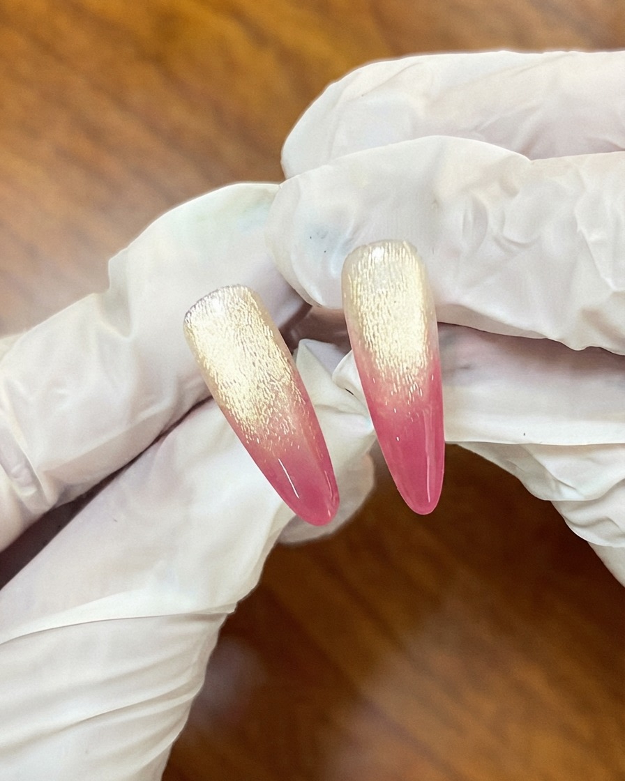 Nails placed inside a UV curing lamp after the first gradient layer application.