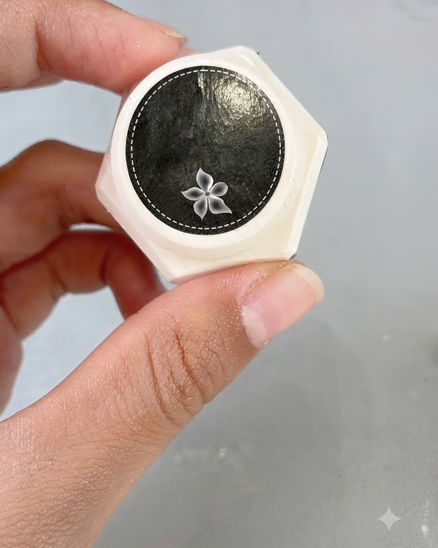 A jar of clear carving gel with a decorative flower icon on the lid.