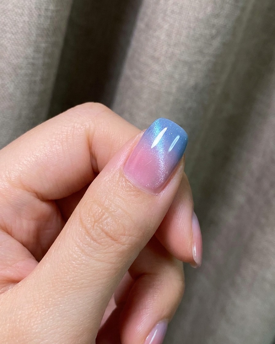 A nail tip curing under a UV/LED lamp after applying the matte top coat.