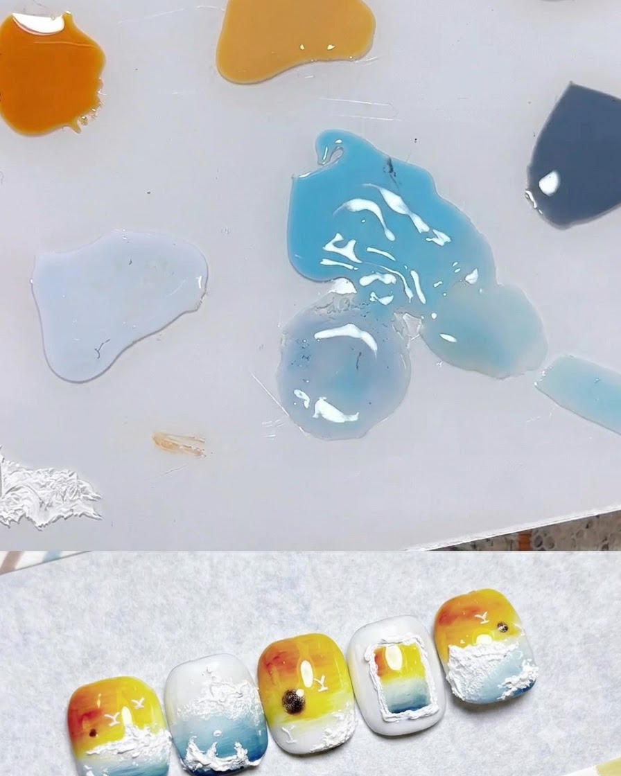 A mixing palette showing drops of various gel colors including pale yellow, orange, and blue next to nail art samples.