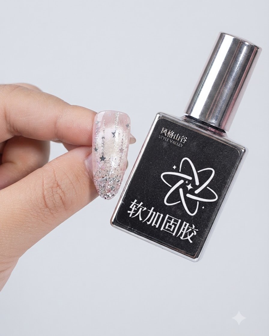 A bottle of Style Valley soft reinforcing gel held next to a decorated nail.