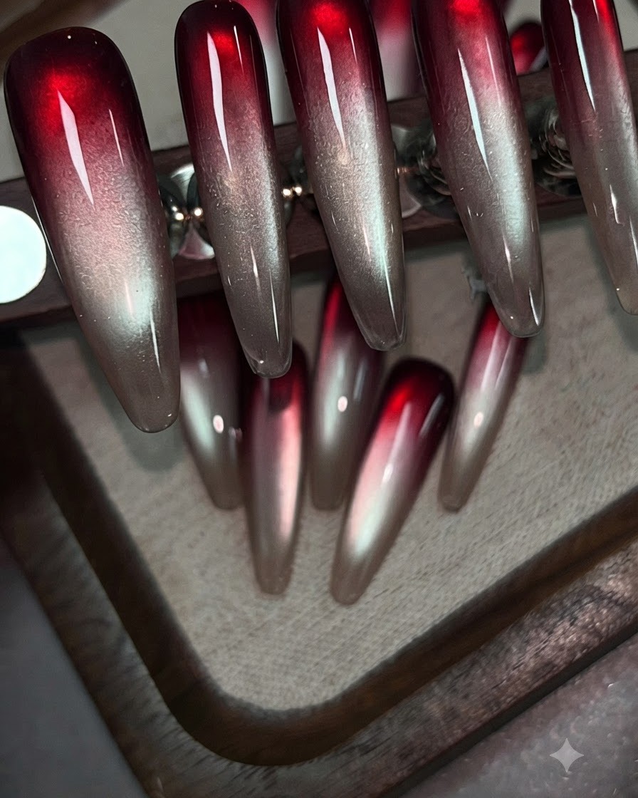 A brush applying wine red patting gel onto the upper portion of a clear practice nail tip.