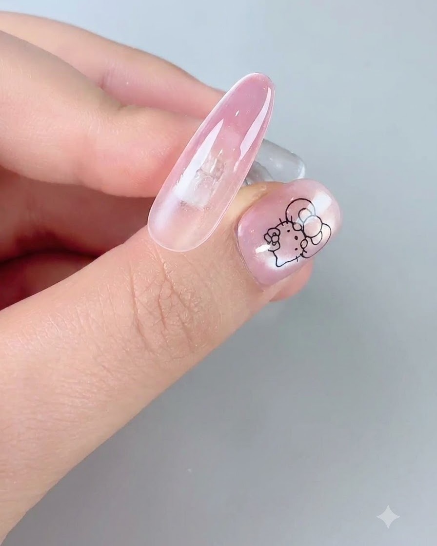 A magnetic wand being held near the nail fingertip to activate cat-eye sparkle.