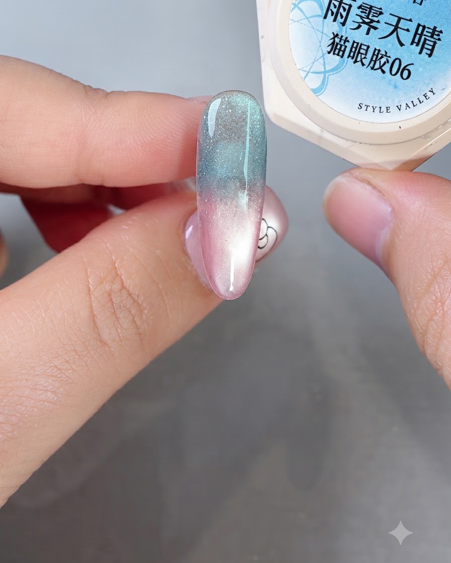 A fine nail art brush applying milky white self-leveling gel onto a gradient-colored nail to form soft abstract shapes.