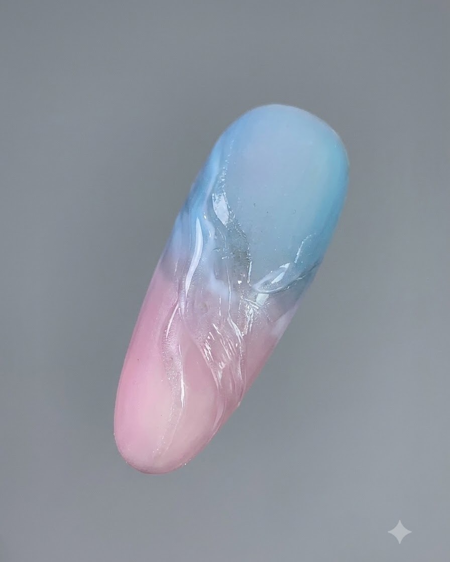 A finished manicured nail sample showcasing dimensional clouds and streamer lines after being fully cured.