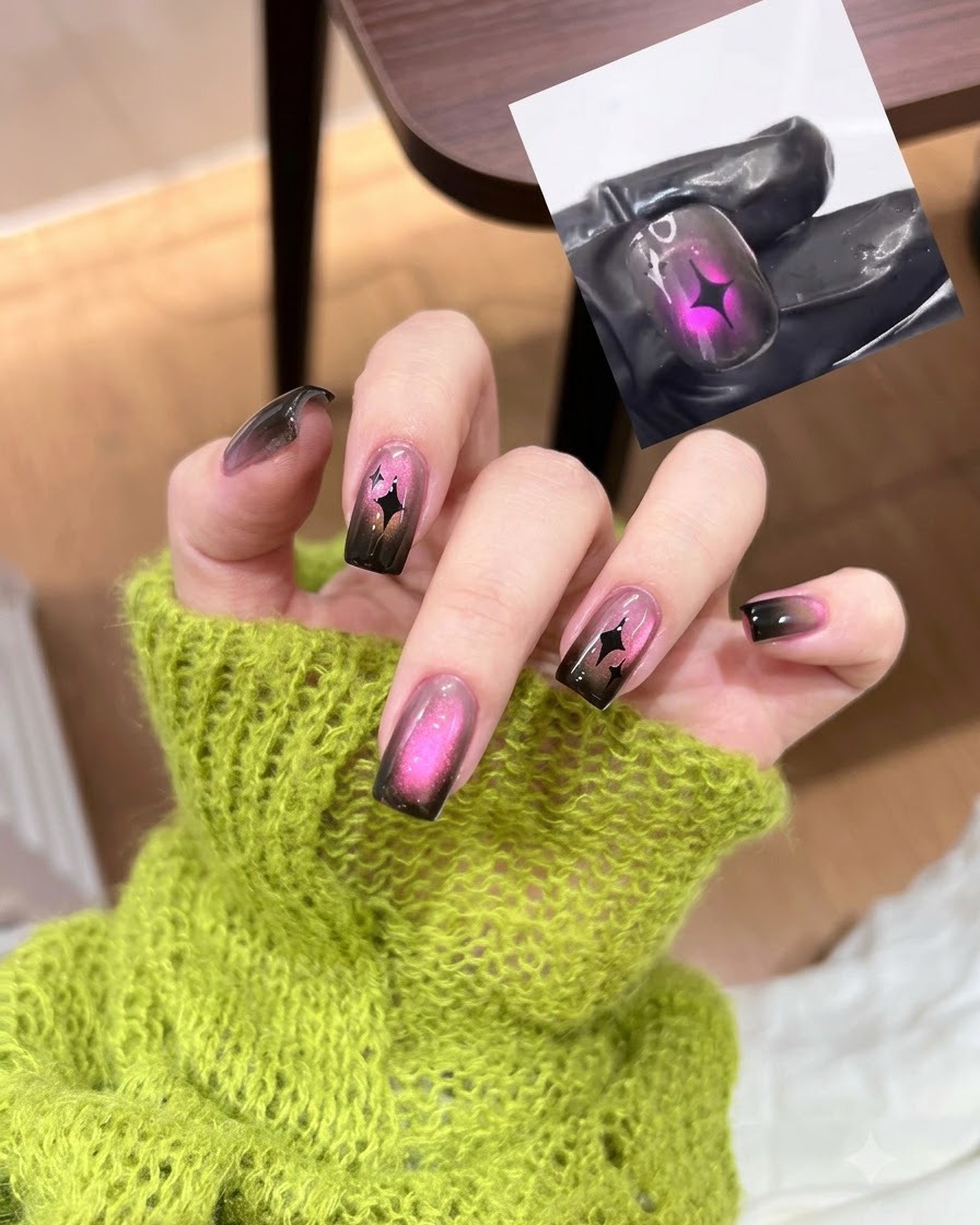 A nail brush applying a coat of sheer black gel polish onto a natural fingernail.