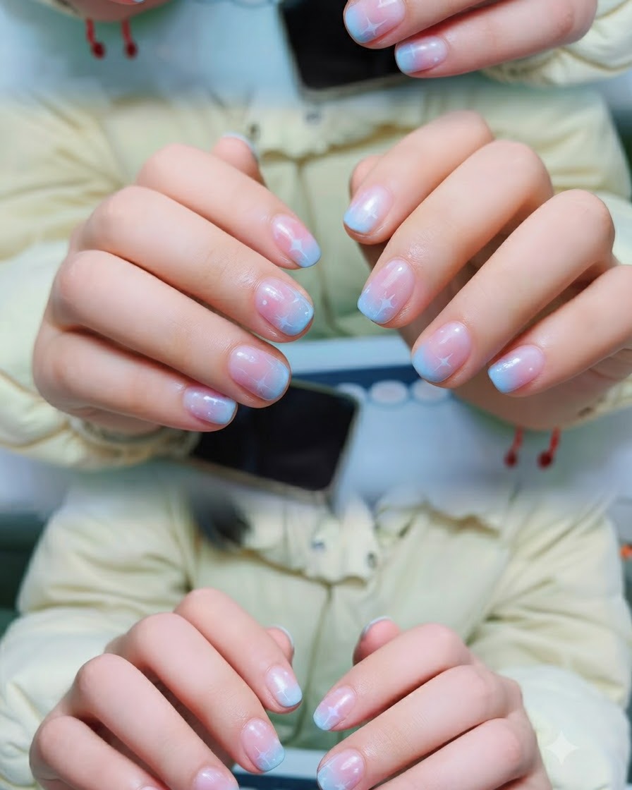 A professional brush applying a thin layer of clear gel base coat onto a clean natural nail.