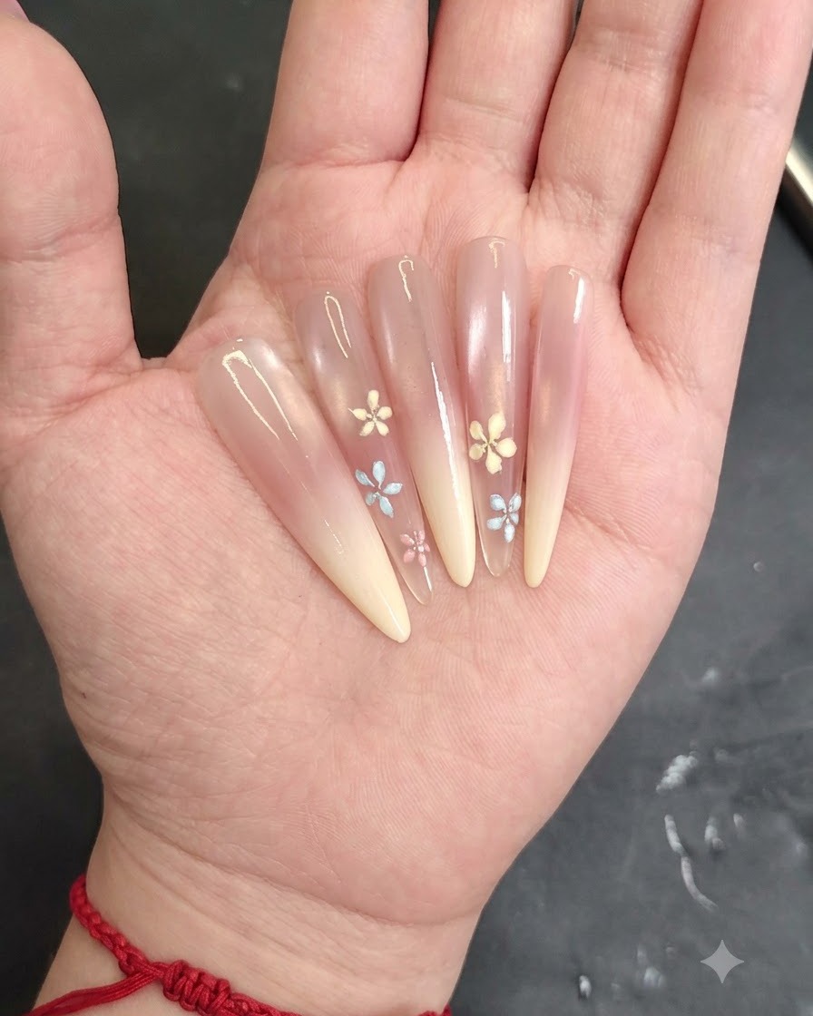 Applying white cat-eye gel to the top half of the nail using a fine brush.