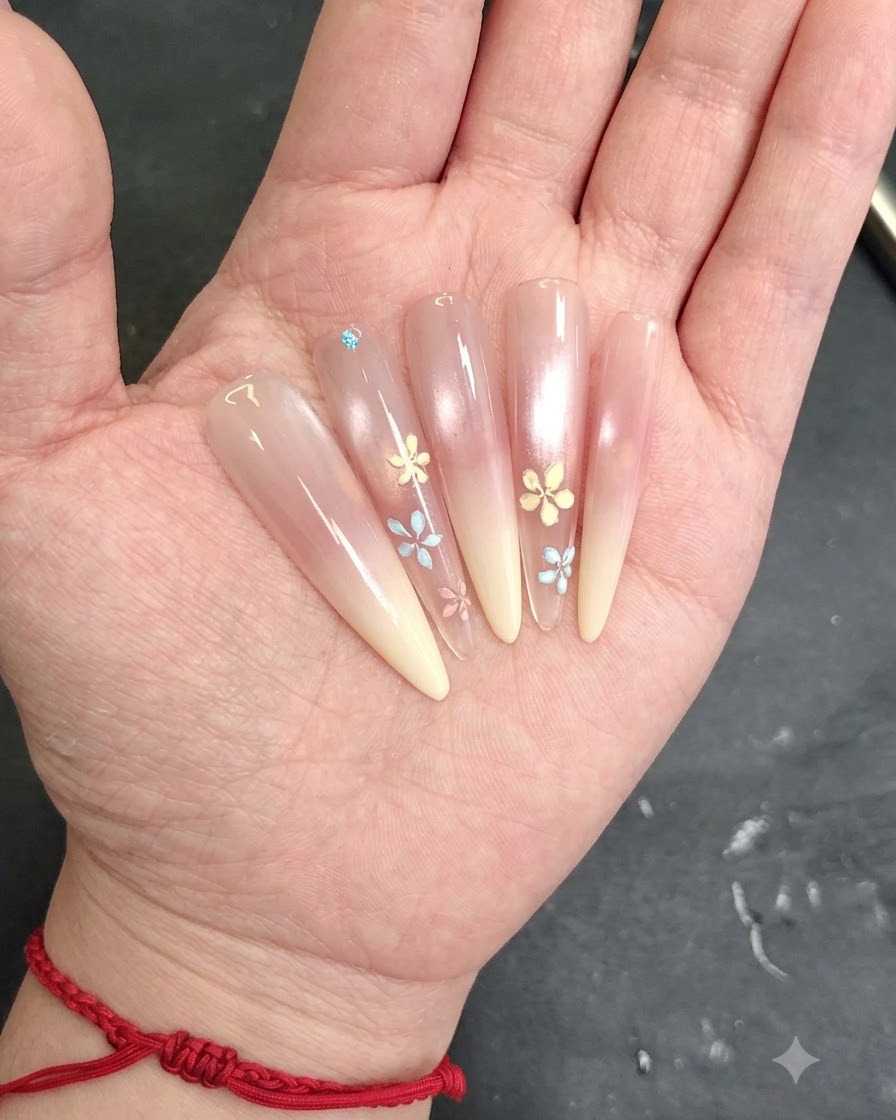 A brush gently blending the white cat-eye gel to create a smooth transition.