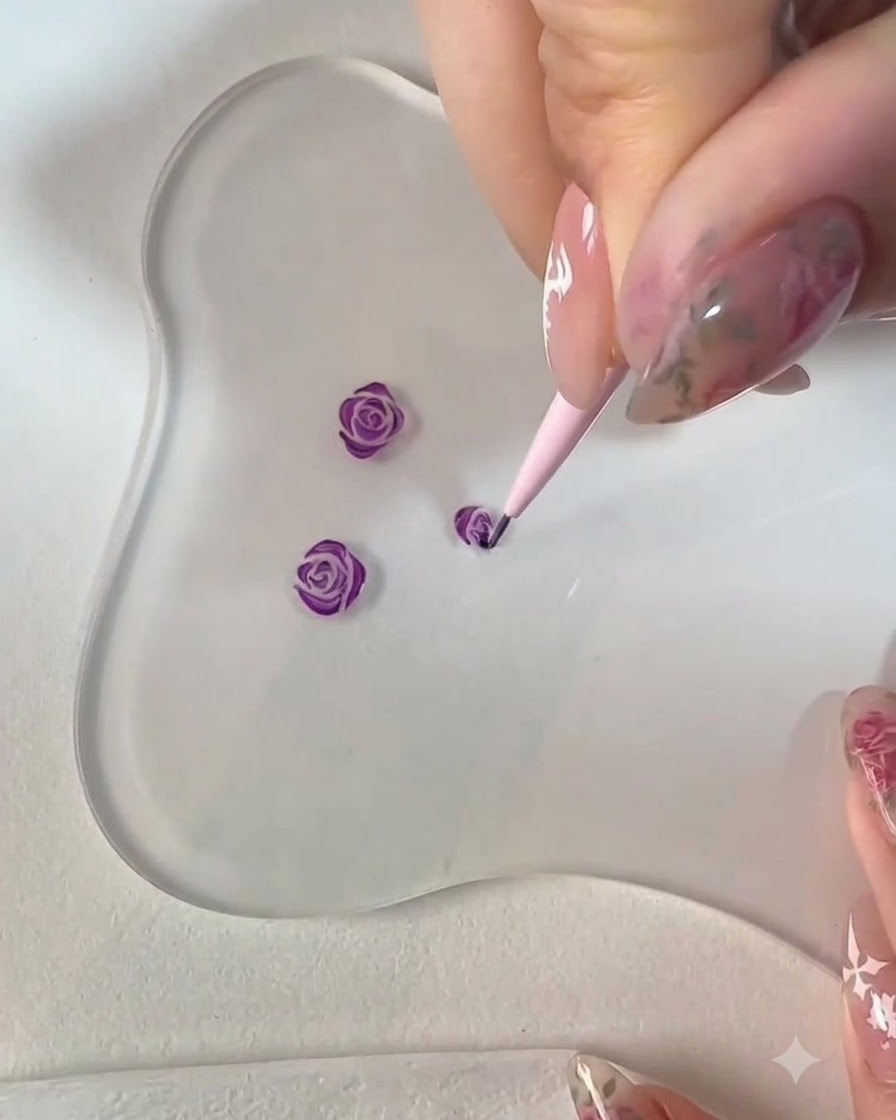 A fine liner brush painting additional petals along the bottom contour of the purple rose art.