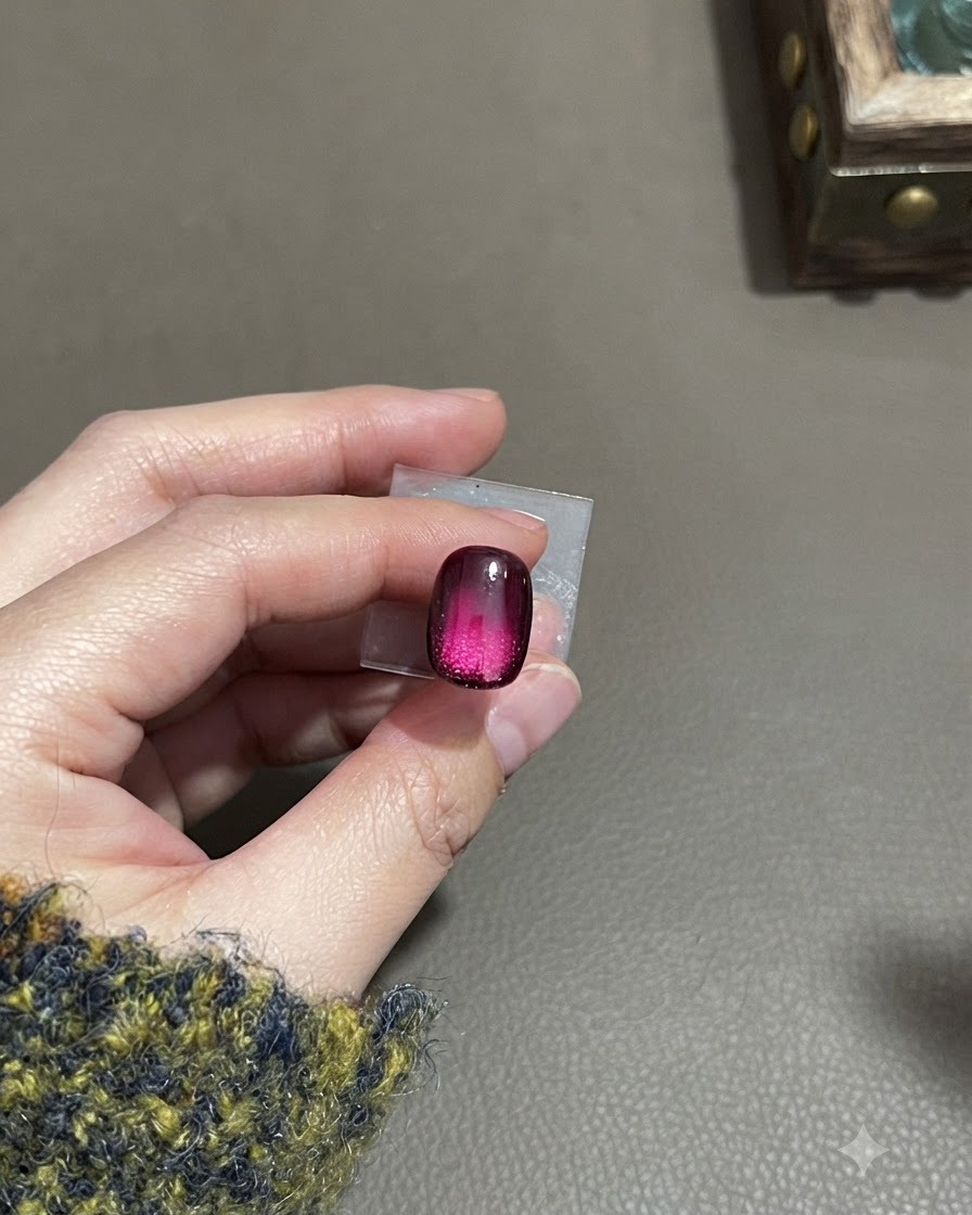 A finished gradient matte cat-eye nail displaying a frosted velvet texture with a concentrated lower-middle highlight.