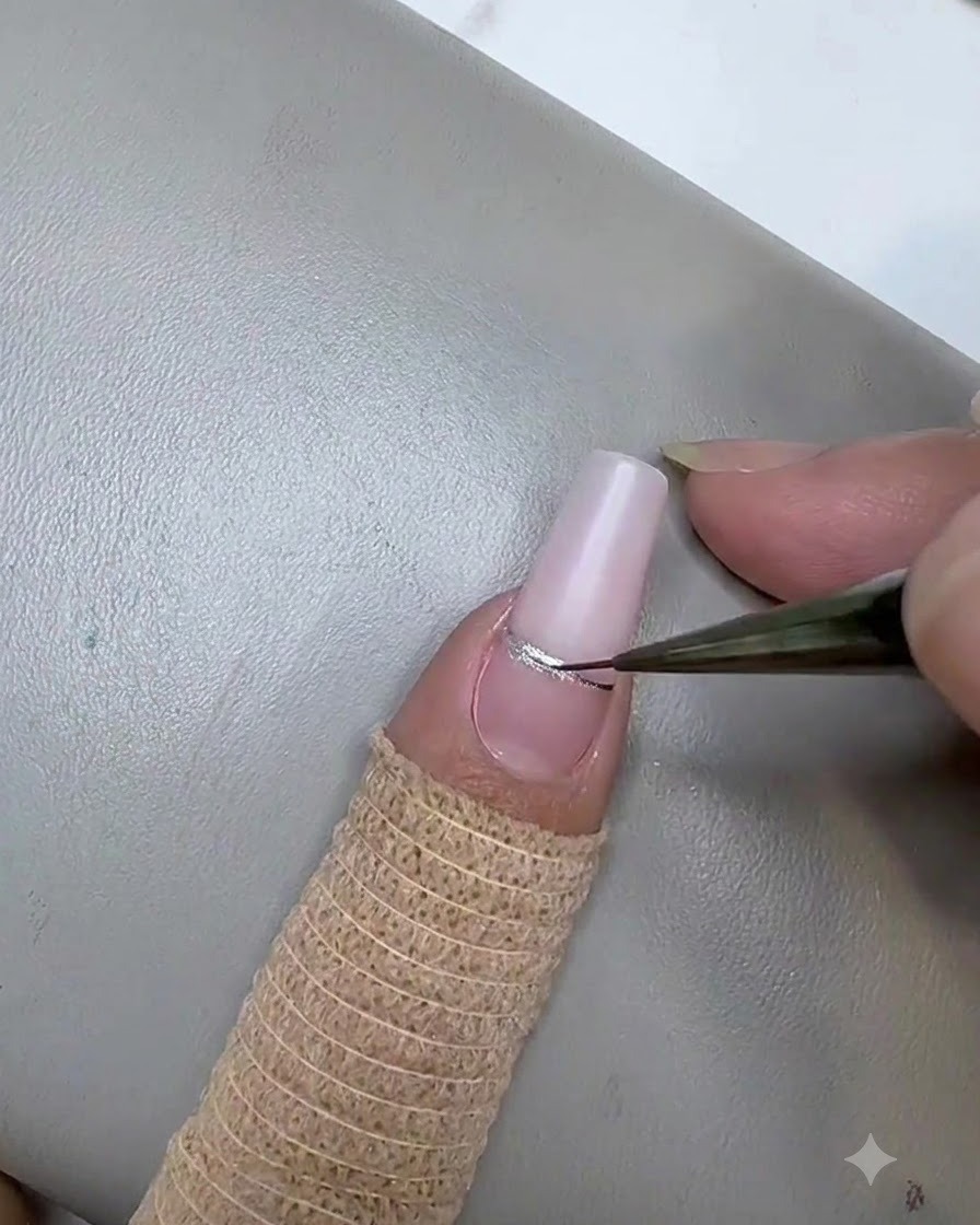 A rectangular magnet held closely over the pink stripe to concentrate the cat eye magnetic particles.