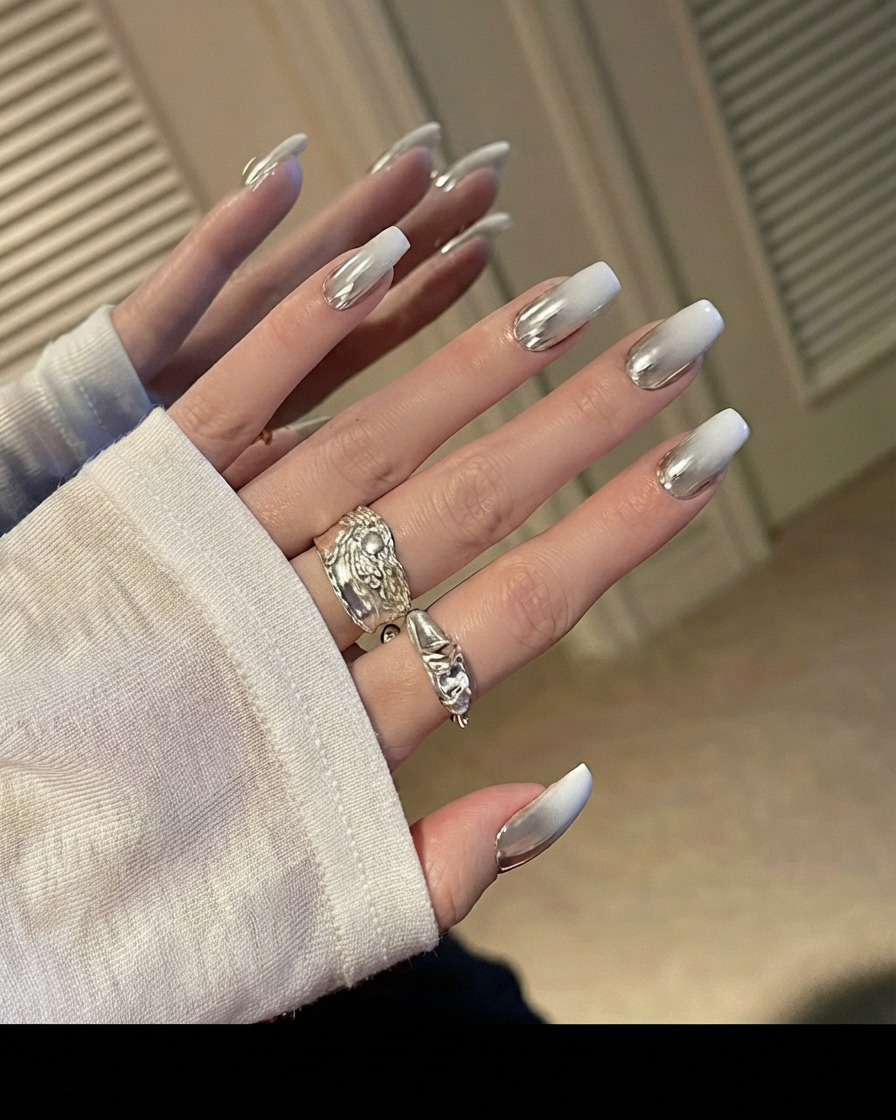A gel brush applying top coat to a clear nail extension.