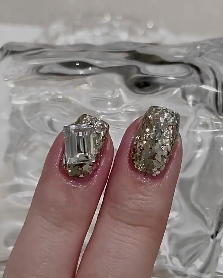 Adding a small drop of gel and extra glitter to fill a gap on the textured nail.