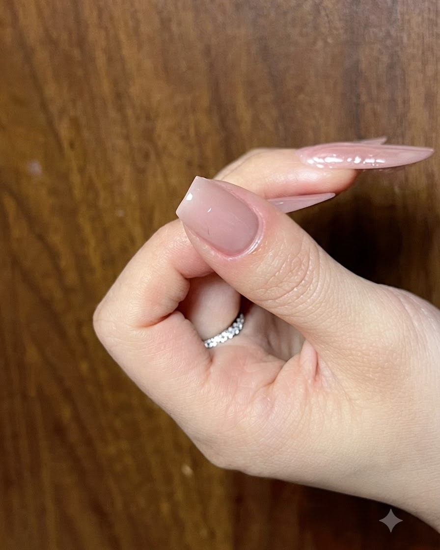 Nail under a UV lamp curing the newly added cat-eye wing tip details.