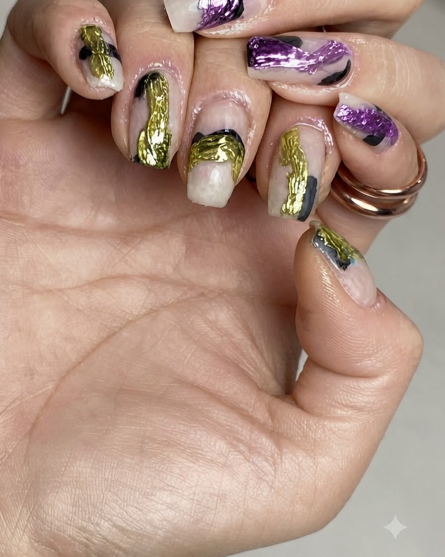 Fingernails placed inside a UV/LED nail lamp curing under purple light.