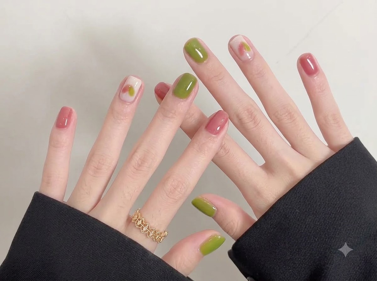 A panning view showing neat cuticles and an even, flawless application of gel polish on short nails.