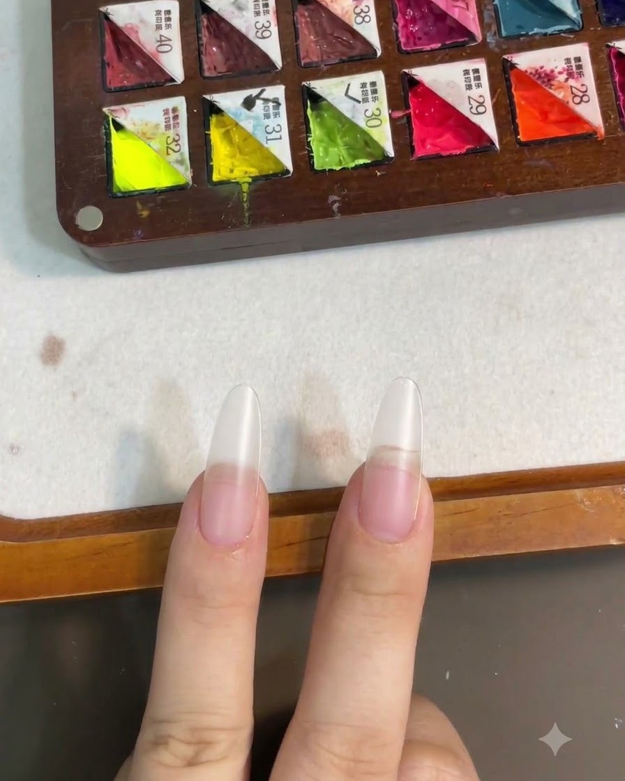 Nails shown after curing the base coat layer under a nail lamp.