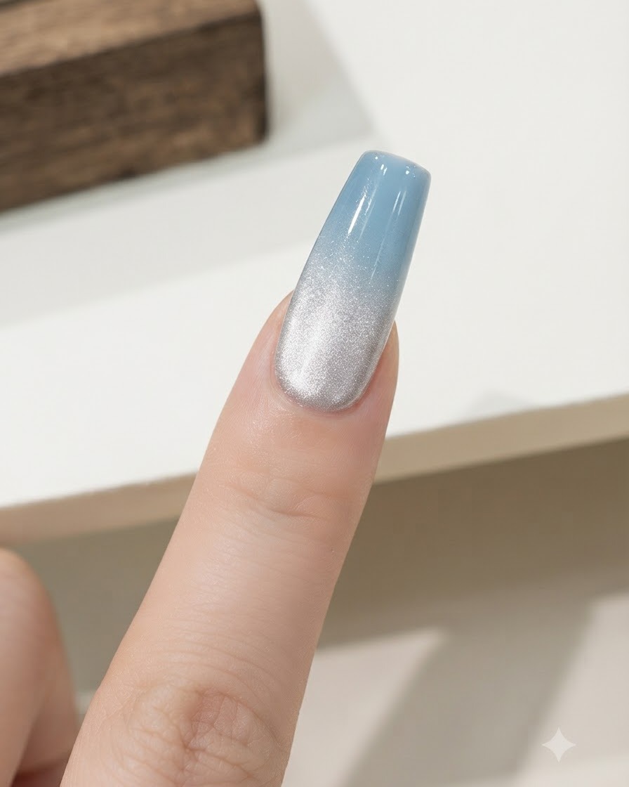 A finger placed inside a compact UV/LED nail curing lamp under bright light.