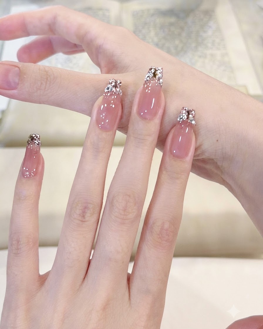 A hand gently pressing down on a thumb press-on nail to showcase flexibility and secure bonding.
