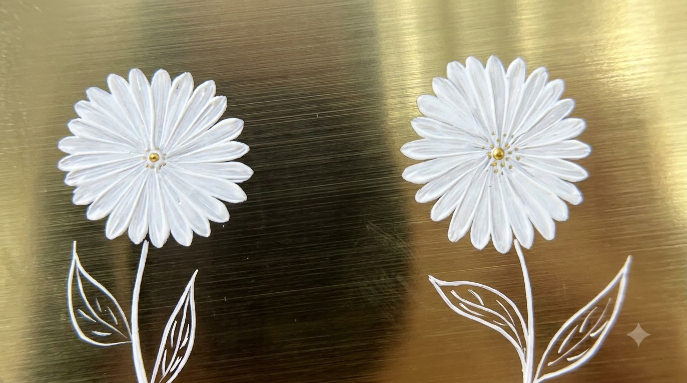 Close-up of a gold round display surface showcasing two completed double-layer hand-painted white small daisy nail art designs with detailed petals and gold centers.
