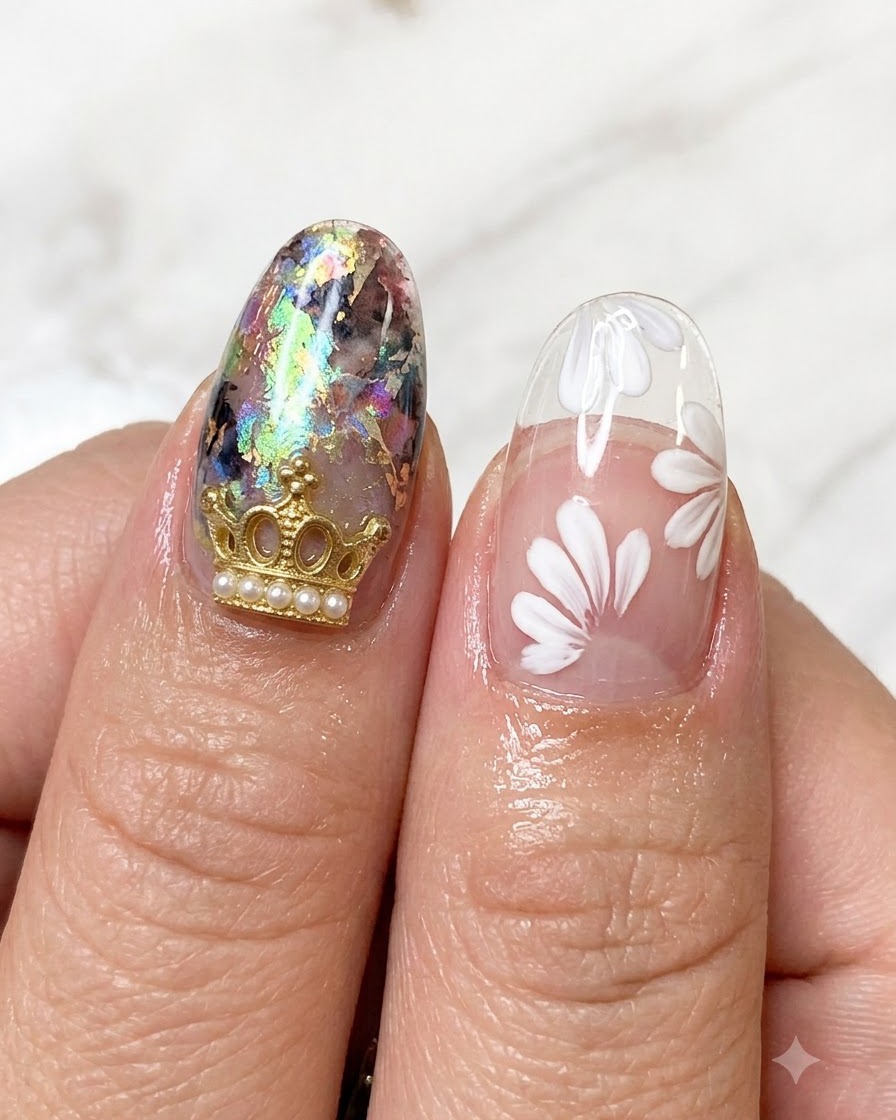 A detailed view of completed white daisy floral patterns painted on a transparent nail extension tip.