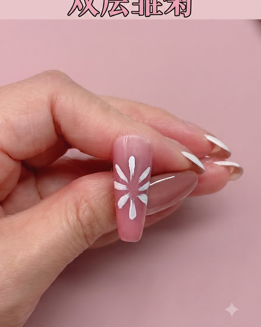 A pink nail featuring newly painted white daisy petals shown against a pink background.