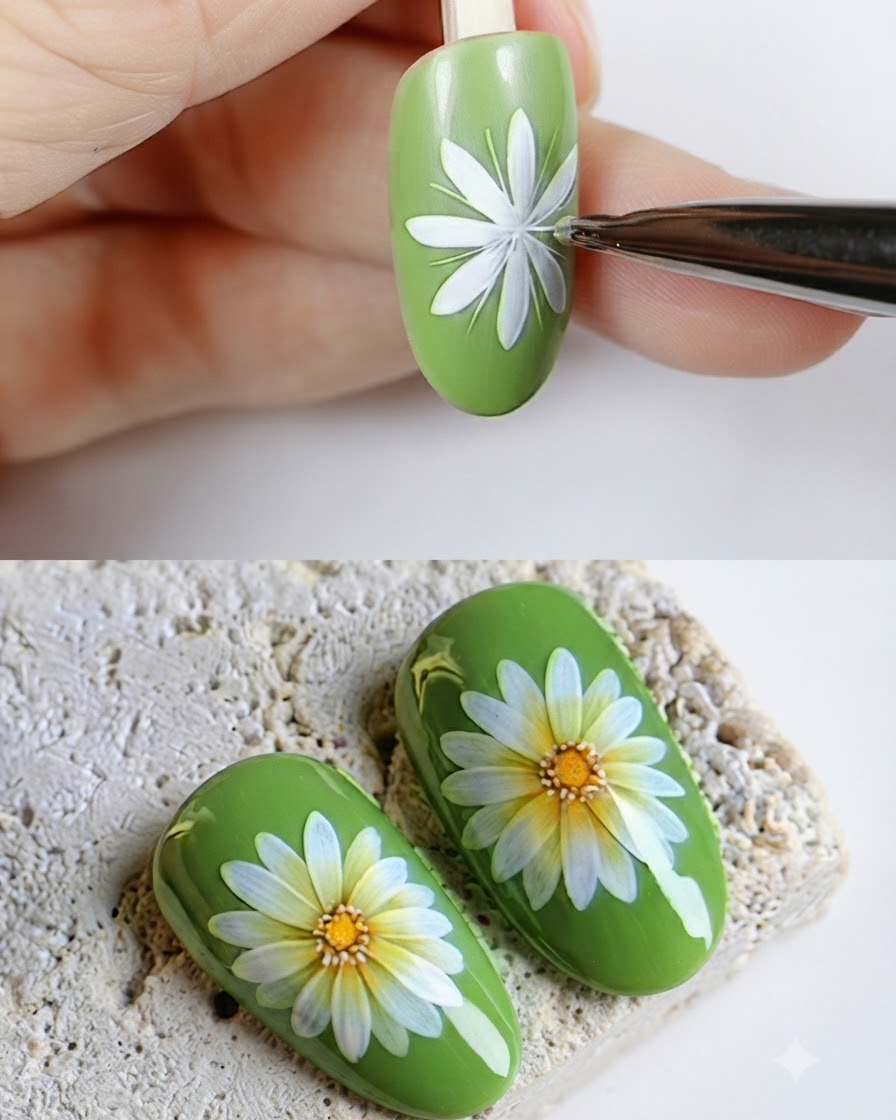 An open container of yellow gel color next to a green nail featuring a painted daisy flower.