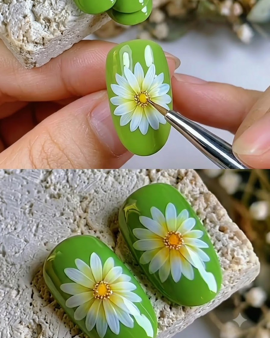 A fine brush applying the final sealing clear coat over a finished daisy nail design.