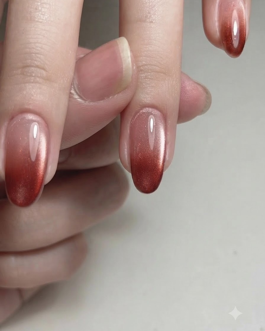 A fine brush applying M03 magnetic gel polish onto the nail plate.