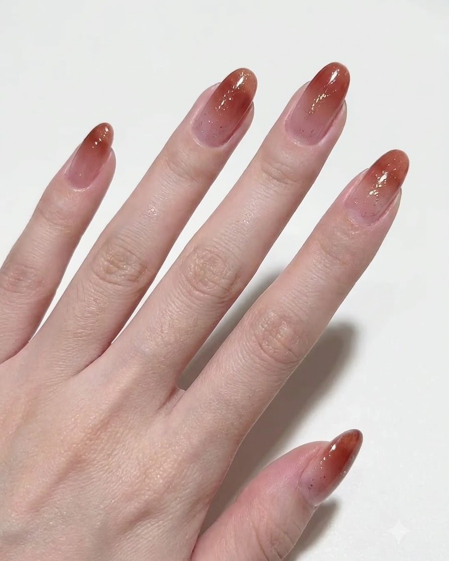 A hand showing multiple fingers with smooth magnetic gel applied.